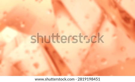 Abstract texture featuring soft orange triangles with speckled details