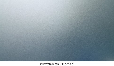 Abstract Texture Of Grey And Light Blue Smooth Brushed Metal Background