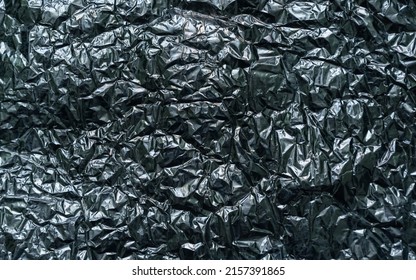 Abstract texture pattern metallic paper using as a background or wallpaper. Metal aluminum foil shiny and reflector. High quality photo