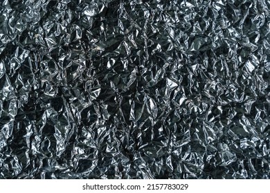 Abstract texture pattern metallic paper using as a background or wallpaper. Metal aluminum foil shiny and reflector. High quality photo