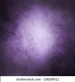 Abstract texture of the purple smoke over black background