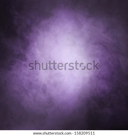 Abstract texture of the purple smoke over black background