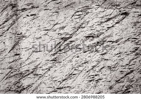 Abstract texture of rough cement wall with splashes of mud stains