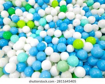 Abstract texture of safe plastic play balls inside a modern family recreation park