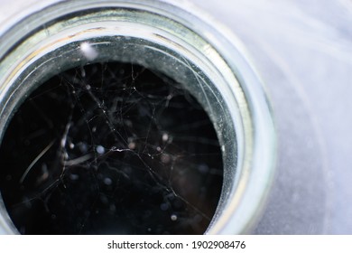 Abstract Texture Of A Spiderweb In A Glass Bottleneck