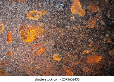 Abstract Texture Of The Surface Of A Cast Iron Pan With Rust Elements