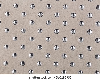 Abstract texture of synthetic leather, studs background.