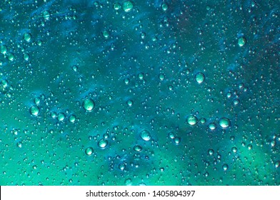 Abstract textured mint background slime with air bubbles inside. Macro of kids toy slime.