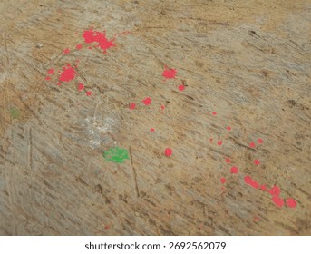 Abstract Textured Surface with Red Splashes, This image features a colorful abstract surface that combines green and blue tones,higligted by vibrant red splashes.