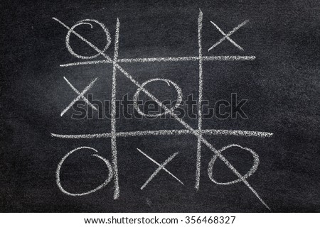 Abstract Tic Tac Toe Game Competition. XO Win Challecge Concept on black board