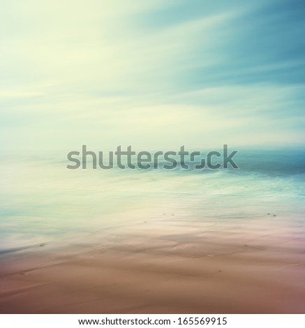 An abstract, time-exposure seascape with panning movement.  Image displays a retro, vintage look with cross-processed colors.