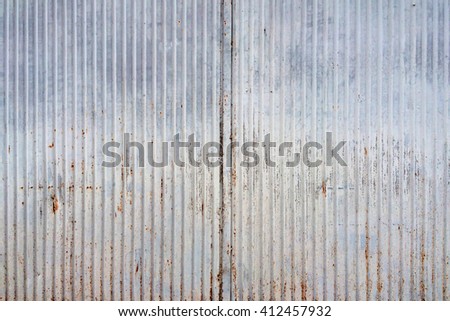 Abstract tin texture with rust and vertical lines. An old metal material texture for your design.