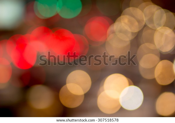 Abstract traffic circle light\
blurred backgrounds: blurred colorful of light ,out of focused\
concept.