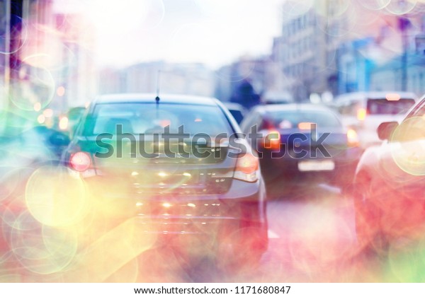 abstract traffic jam background on road / bokeh,\
view of transport, auto on the road in blurred background, cars,\
rear light, stop\
signal