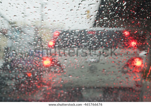 Abstract traffic in raining day. View from car\
seat. Background in retro\
filter