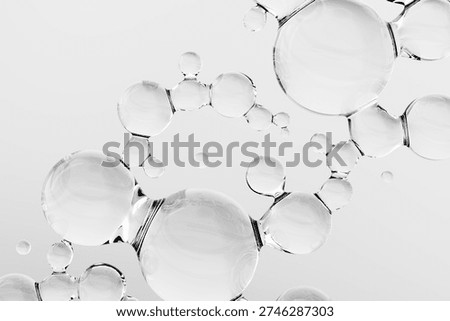 Abstract transparent molecular structure with connected glass spheres on white background. 3D render symbolizing chemistry, biotechnology, skincare innovation, nanotechnology and scientific research.