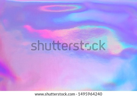 Abstract trendy holographic background in 80s style. Blurred texture in violet, pink and mint colors with scratches and irregularities. Pastel colors.