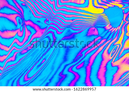 Abstract trendy neon colored psychedelic fluorescent striped zebra color waves textured neon background. 1960s Style Color Waves backdrop. 