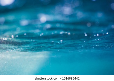 Abstract underwater photograph of sunlight passing through smashing waves. Image made in Greece. - Shutterstock ID 1316995442
