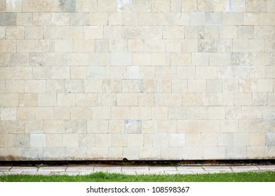 Abstract Urban Wall With Grass And A Sidewalk