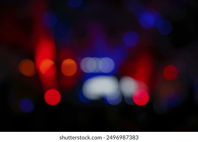 Abstract and vibrant image captures the essence of a concert or night event with a stunning array of blue and red lights. The bokeh effect creates an out-of-focus view of the lights - Powered by Shutterstock