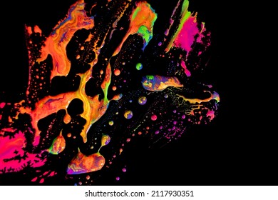 Abstract vibrant multi-color wet paint drops and splotch on black background. Bright orange and pink neon colors. Street art isolated