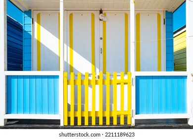 Abstract View Of A Brightly Painted Beach Hut Located By A Famous Beach On The Suffolk Coast In The UK.