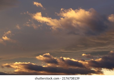 Abstract view of a colorful sky during summer. Many clouds with the sun. Bright colors with vivid lights. - Shutterstock ID 2176738139