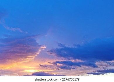 Abstract view of a colorful sky during summer. Many clouds with the sun. Bright colors with vivid lights. - Shutterstock ID 2176738179