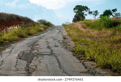 Abstract view of an empty road in the middle of nowhere, quiet landscape scene with minimal composition and a sense of isolation and open journey.