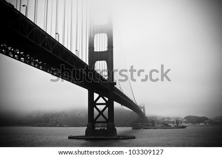 Abstract view of Golden Gate Bridge with battleship below