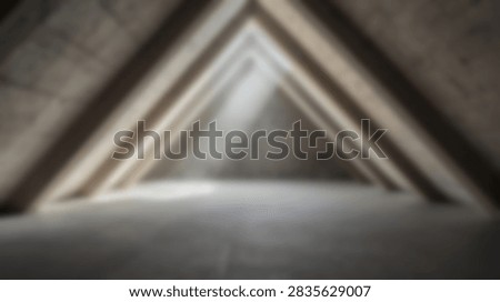 An abstract view inside a triangular tunnel with dramatic light beams illuminating the space.