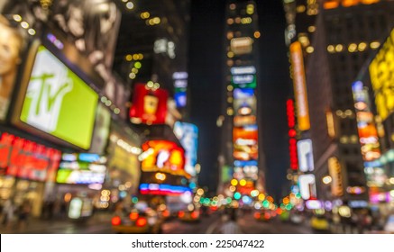 Abstract view of the lights of Times Square in New York city at night. - Shutterstock ID 225047422