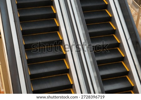 Abstract View of Parallel Escalators Representing Movement and Progress