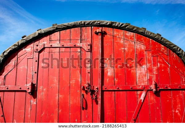Abstract view of a\
pre-war wooden train wagon used for fruit delivers. Showing the\
side door entrance.