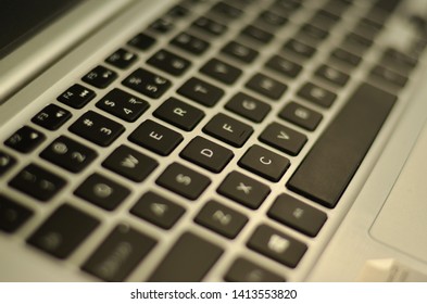 Abstract view of qwerty keyboard in an office setup