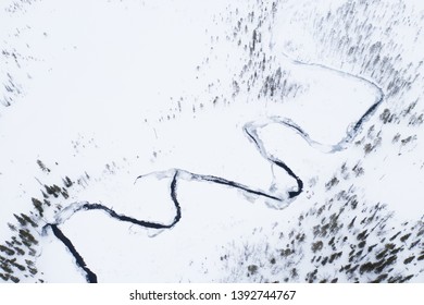Abstract view to river between two fells in winter landscape, Lapland Finland