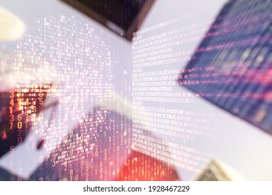 Abstract virtual code skull illustration on office buildings background. Hacking and phishing concept. Multiexposure