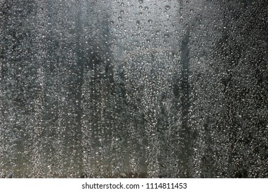 Abstract, Water Droplets On A Glass Shower Door.