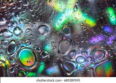 Abstract Water Drops on Colorful Background. Oil Bubbles on Water Surface with Holographic Effect. Design of Creative Watery Texture.