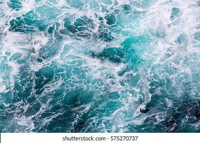 Abstract water image shows unique water movement that can be used for backgrounds or as a picture.  This surface ocean image has a unique texture and rich aqua colors.