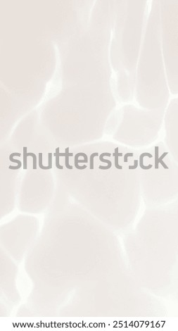 Abstract water rays of light reflections shadow overlay effect through glass on a white background reflection. Abstract blurred crystal glasses light.