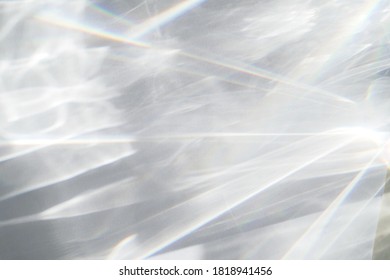 Abstract water texture overlay effect, rays of light  shadow overlay effect with rainbow reflection of light from water on a white background, mockup and backdrop - Shutterstock ID 1818941456