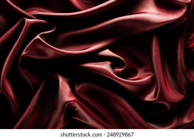 Abstract wave textile texture or background in marsala color 库存照片