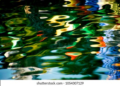 Abstract waves reflection multicolor on the water 