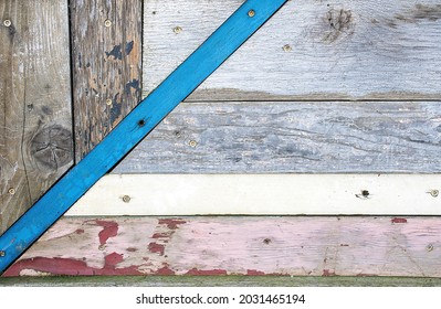 Abstract Weathered Wood Pattern With Faded Pink And Blue Paint