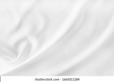 Abstract White Bedding Sheets Or Blanket Background And Texture With Copy-space :Creased Or Wrinkled White Fabric :Soft Focus