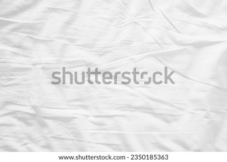 Abstract White Bedding Sheets or White wrinkled fabric background texture and Texture with copy-space :Creased or wrinkled white fabric,Soft focus