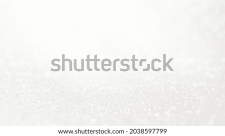 Abstract white bokeh glitter background. Blur background. Abstract background