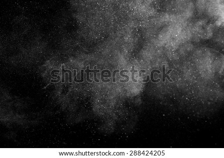 abstract white dust explosion  on a black background. 